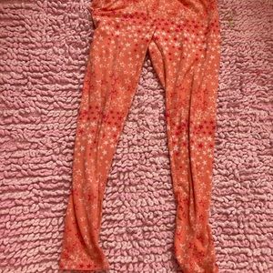One step up orange stars leggings M
